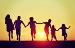 happy-children-silhouettes-on-summer-meadow-running-and-jumping.jpeg